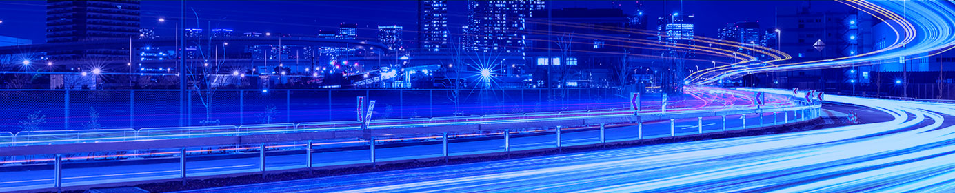 speeding lines on a highway against a cityscape