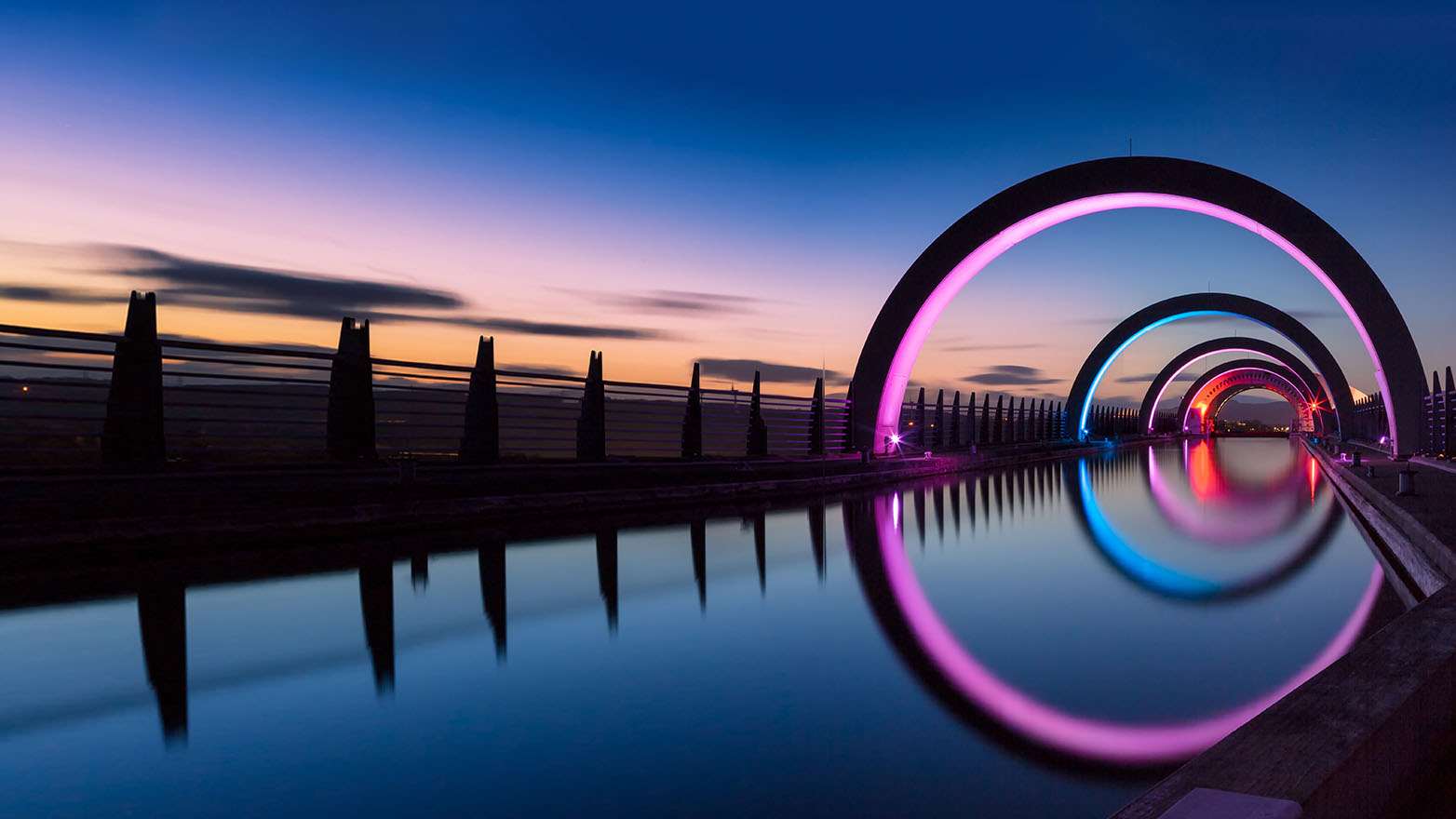 neon arches over water